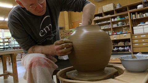 making a pot on the potter's wheel