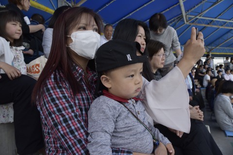 Mr. Ugyen Dorji's wife, son and a sister are watching a dolphin show for the first time and they look amazed by the show