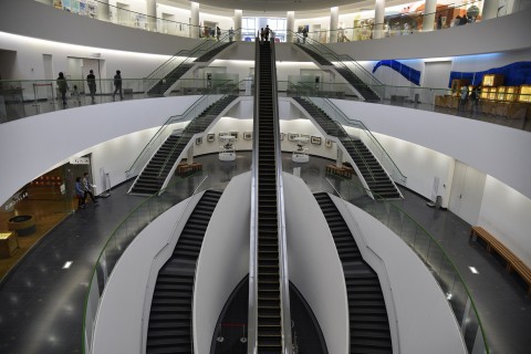 the long 33 meters long escalator in front of the entrance of the museum