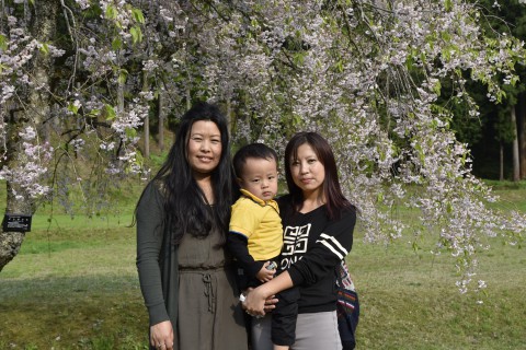 Mr. Ugyen Dorji's sister and his wife holding their son