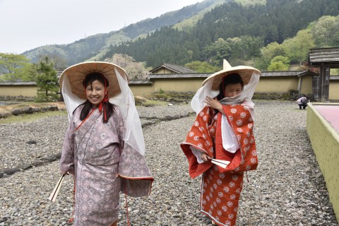 Mr. Ugyen Dorji's sister and his wife are wearing the Warring State Period's kimono and walking in the restored town