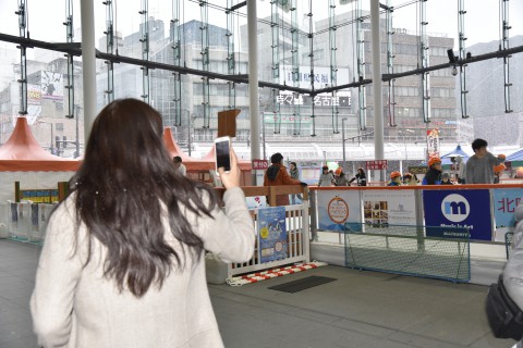 Sonam Choki was amazed by large snow flakes taking photos of them next to the ice skating rink near Fukui station