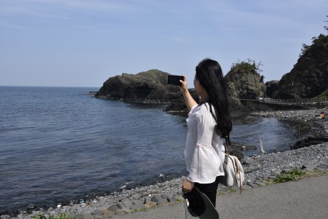 Mr. Ugyen Dorji's sister is looking at the Sea of Japan