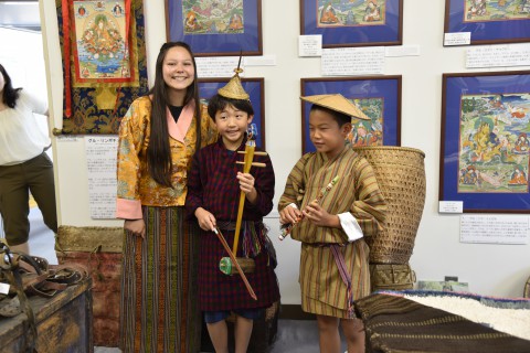 a high school girl from America and two Japanese elementary school boys wore the Bhutanese clothing