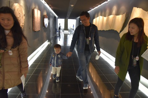 Mr. Ugyen Dorji and his son, wife and siter are walking in the dinosaur museum in Fukui
